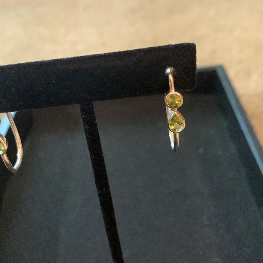 .925 Sterling silver and Peridot post earrings.